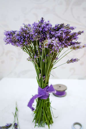 Fresh lavender bouquet on light ornament backgroundの写真素材