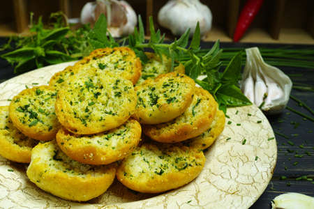 Bread toasts with basil, chives and garlic, rustic styleの写真素材