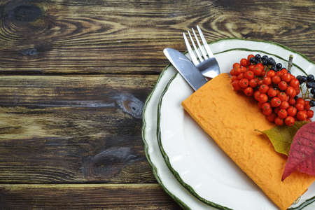 Autumn restaurant menu free text copy space and table setting on wooden backgroundの写真素材