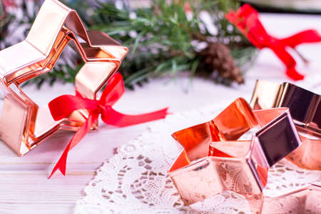 Star-form copper baking pasry form for Christmas cookies with Christmas decorationの写真素材