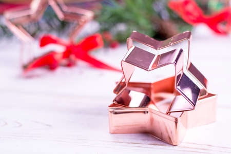 Star-form copper baking pasry form for Christmas cookies with Christmas decorationの写真素材