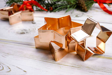 Star-form copper baking pasry form for Christmas cookies with Christmas decorationの写真素材