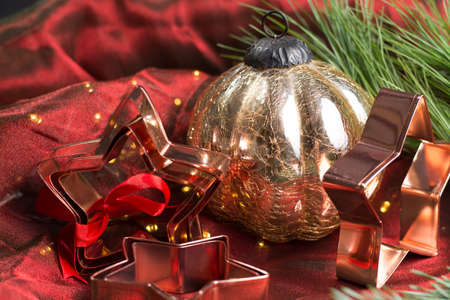 Christmas decoration - big handmade shiny ball from heavy glass on red background with lightsの写真素材