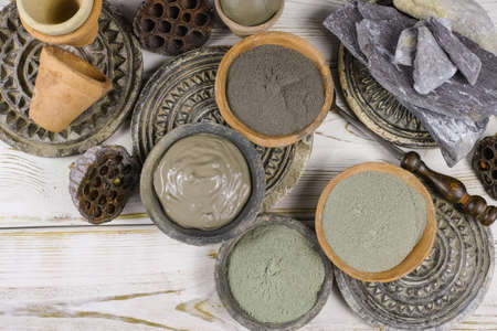 Ancient minerals - black, green, blue clay powder and mud mask for spa, beauty conceptの写真素材