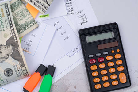 Utility or mortgage bills, calculator and US dollars - finance concept, payments and problemsの写真素材