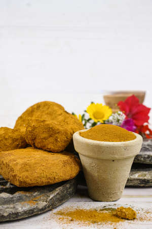 Ancient minerals - bright ochre stones and powder for spa and natural color paint pigment