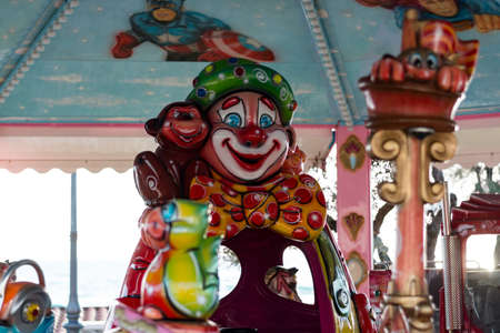 Vintage carousel clown sunny dayの写真素材