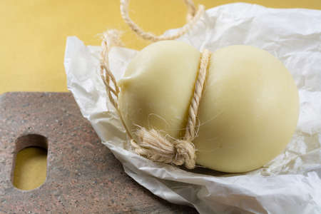 Best Italian food - fresh caciocavallo cheese on granite backgroundの写真素材