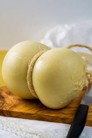 Best Italian food - fresh caciocavallo cheese on olive wood board