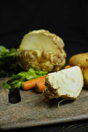 Ingredients for celeriac soup - celery root - celeriac, carrots, onion, potatoes - healthy diet conceptの写真素材