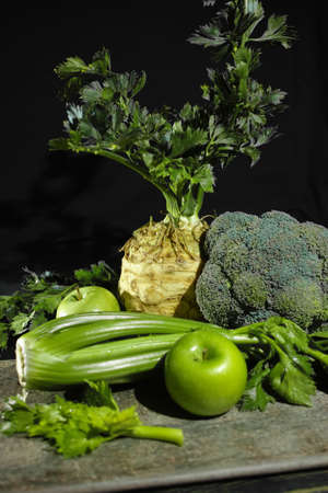 Green vegetables and fruits -  celery, apples, celery root celeriac, broccoli, healthy diet conceptの写真素材