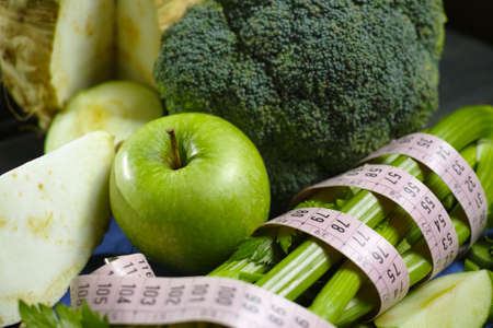 Green vegetables and fruits -  celeriac, broccoli, celery shoots and  apples, healthy fitness diet conceptの写真素材