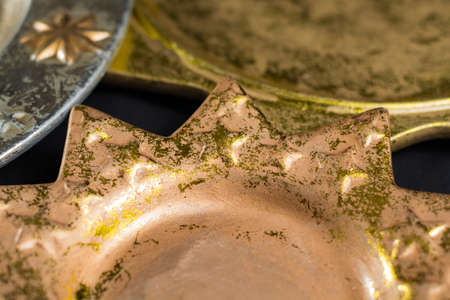 Vintage golden and silver color christmas plates, decoration and backgroundの写真素材