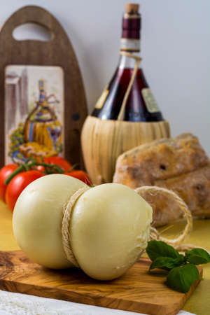 Best Italian food - fresh caciocavallo cheese on olive wood boardの写真素材