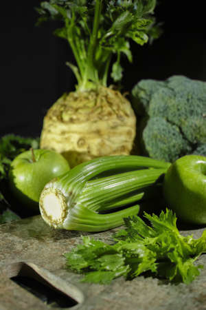 Green vegetables and fruits -  celery, apples, celery root celeriac, broccoli, healthy diet conceptの写真素材