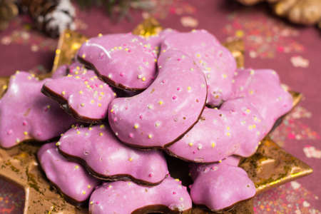 Christmas spicy cookies - colorful shaped cookies  on golden plate and Christmas decoration