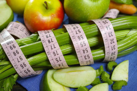 Green vegetables and fruits -  celery shoots and  apples, healthy fitness diet conceptの写真素材