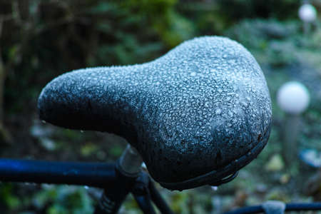 Winter in Holland - frozen bicycle saddle with hoarfrostの写真素材
