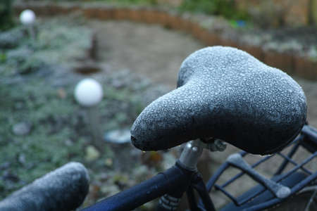 Winter in Holland - frozen bicycle saddle with hoarfrostの写真素材