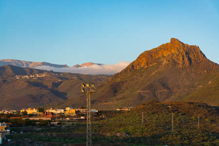 Sunset on Tenerife - small volcanos in countryside, live is the village