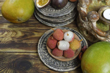 Tropical fruit - Lychees on wooden backgroundの写真素材