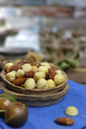 Roasted salted nuts mix, snack from macadamia, walnotes and almonds and unshelled nutsの写真素材