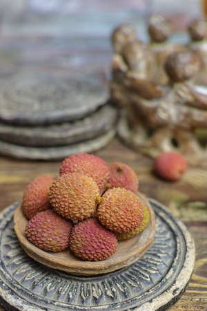 Tropical fruit - Lychees on wooden backgroundの写真素材