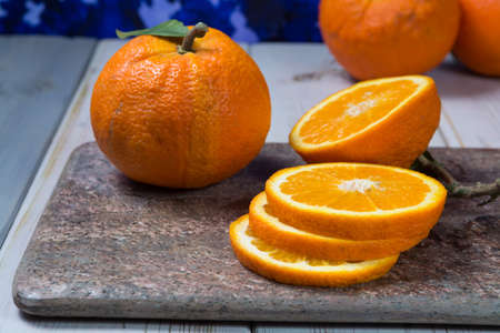 Giant ripe organic oranges from farm in Spain with leaves on the marketの写真素材