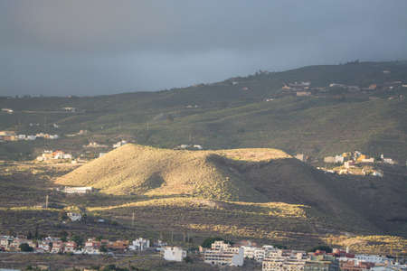 Sunset on Tenerife - small volcanos in countryside, live is the villageの写真素材