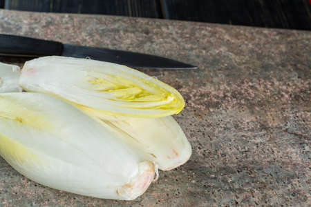Fresh and healthy Chicory (witloof) Salad on a plate. Dietary menu.の写真素材