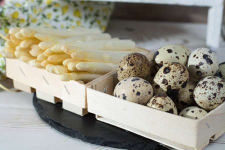 Spring season, diet meal - fresh white asparagus and quail eggs