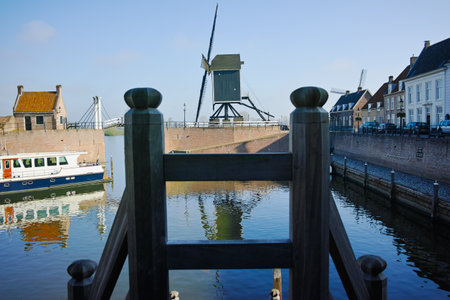 Small river harbor, drawbrige and windmill in Heusden - old village in Brabant, the Netherlandsのeditorial素材