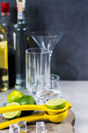 Lime manual press for preparation of cocktails, limes and glass with ice cubes, party timeの写真素材