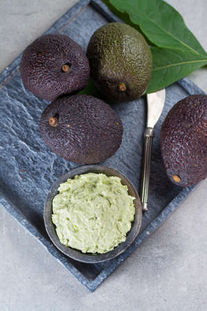 Homemade fresh avocado cream, ready to eat, tasty healthy vegetarian food, modern style