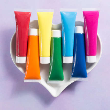 Rainbow colours heart - multicolored rainbow acrylic paints tubes set, happy colorful world conceptの写真素材