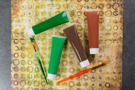 Colours of the nature - mix of green and brown - home or office interieur design concept, tubes with acrylic paint and  brush, close upの写真素材