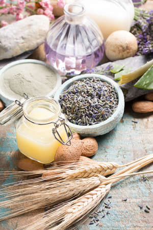 Nature cosmetics, handmade preparation with essential oils and ancient minerals of  parfums, skincare, creams, soaps from fresh and dried lavender flowers, roses, wheat, almond nuts, green clay powder in French artisanal boutique home styleの写真素材