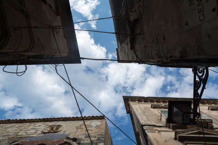 Architecture, narrow streets crossing, look at the houses from the bottom up.の写真素材