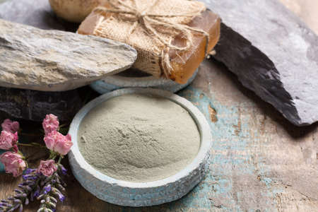 Nature cosmetics, handmade preparation with essential oils and ancient minerals of creams, soaps, skincare masks, scrubs from fresh and dried lavender and roses flowers, green clay powderの写真素材