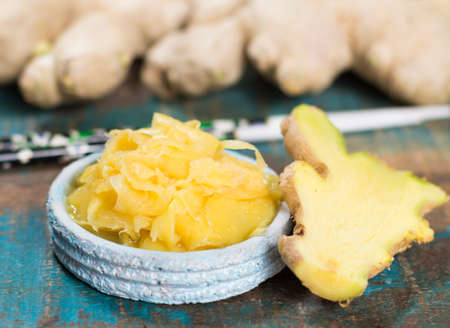 Red bowl of delicious fresh pickled sushi ginger, ready to eat, asian food conceptの写真素材