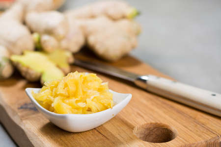 Red bowl of delicious fresh pickled sushi ginger, ready to eat, asian food concept
