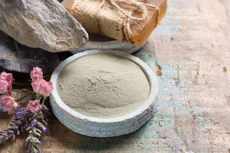 Nature cosmetics, handmade preparation with essential oils and ancient minerals of creams, soaps, skincare masks, scrubs from fresh and dried lavender and roses flowers, green clay powderの写真素材