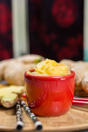 Red bowl of delicious fresh pickled sushi ginger, ready to eat, asian food conceptの写真素材