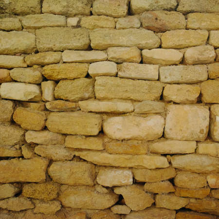 Old stones urban wall texture, wallpaper, designer template close upの写真素材