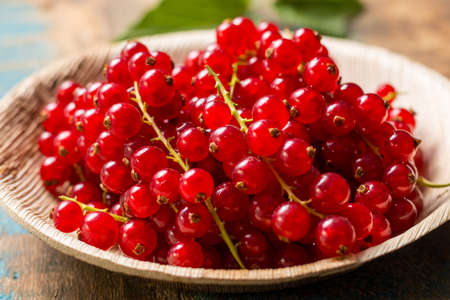 Fresh ripe red currant berries on the table, healthy foodの写真素材