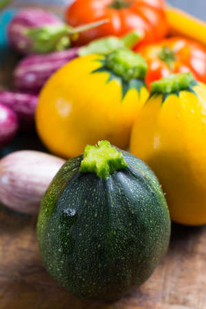 Fresh colorful organic vegetables - round courgette, small eggplants, tomatoes, diet concept, Italian and French food, healthy food.の写真素材