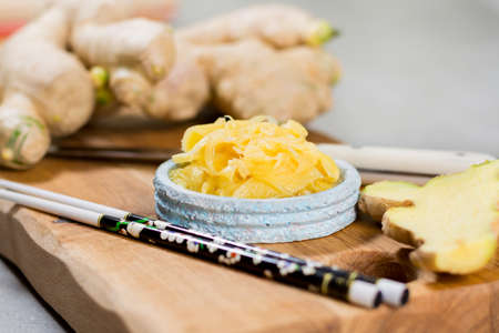 Red bowl of delicious fresh pickled sushi ginger, ready to eat, asian food conceptの写真素材