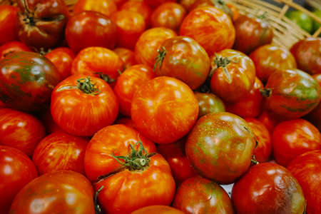 Ancient Provencal french ripe farm tomatoes on the street marketの写真素材