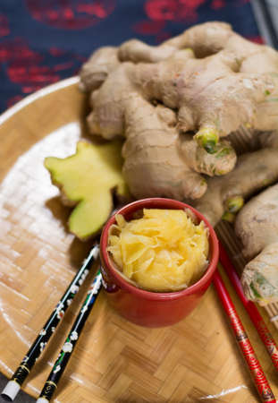 Red bowl of delicious fresh pickled sushi ginger, ready to eat, asian food conceptの写真素材