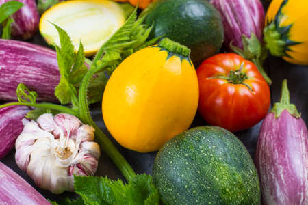 Fresh colorful organic vegetables - round courgette, small eggplants, tomatoes, diet concept, Italian and French food, healthy food.の写真素材